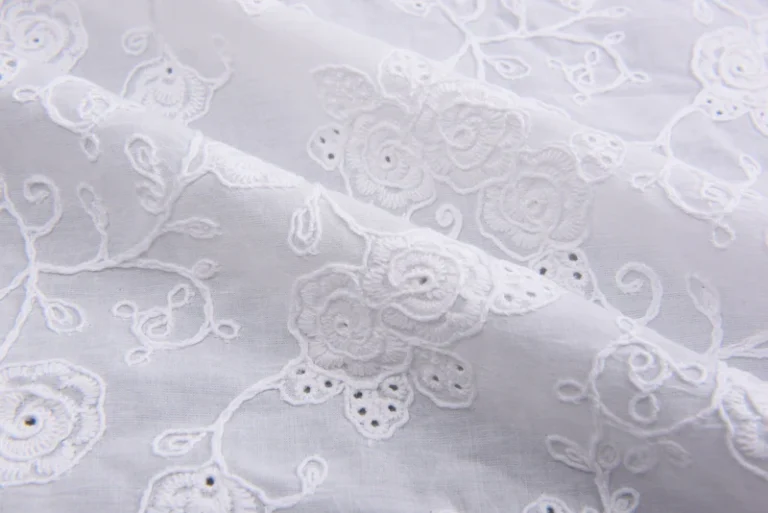 Exploring the Charm of White Cotton Fabric With Intricate Embroidery
